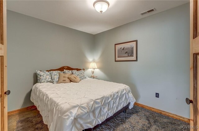 bedroom with visible vents and baseboards