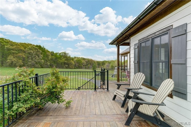 deck featuring a view of trees