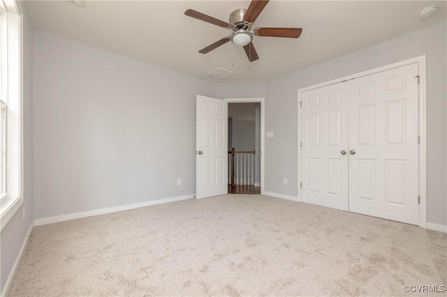 unfurnished bedroom featuring baseboards and carpet