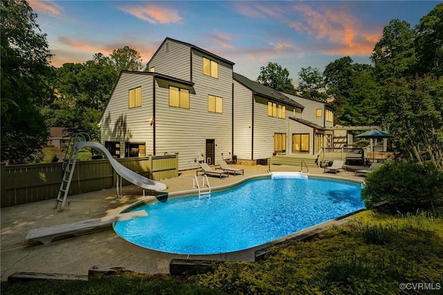3 Welwyn Pl, Henrico, VA 23229 - back of property at dusk with a wooden deck, a patio area, and fence