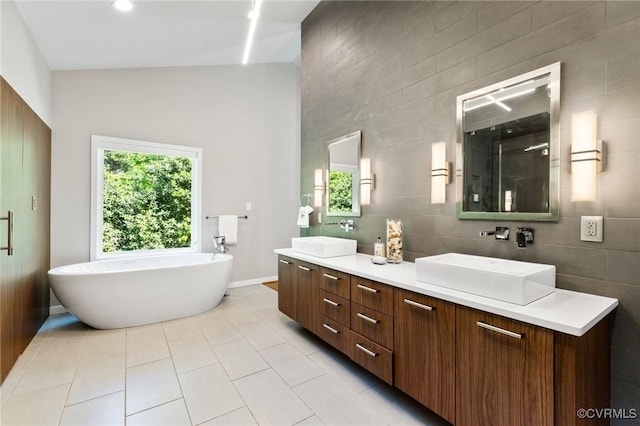 3 Welwyn Pl, Henrico, VA 23229 - bathroom with tile patterned flooring, double vanity, tile walls, a freestanding tub, and a shower with door