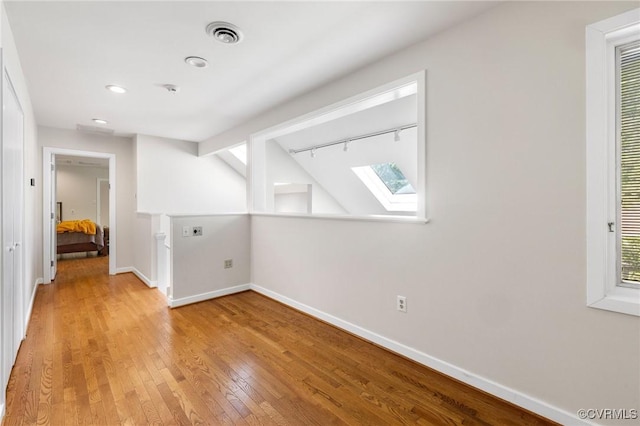 3 Welwyn Pl, Henrico, VA 23229 - bonus room featuring a skylight, light wood-style floors, baseboards, and recessed lighting