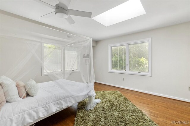 3 Welwyn Pl, Henrico, VA 23229 - bedroom featuring a skylight, baseboards, ceiling fan, and wood finished floors