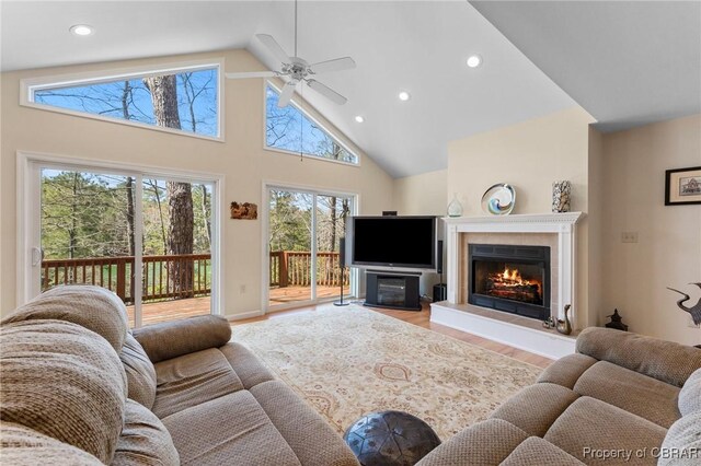 637 Mallard Bay Dr, Heathsville, VA 22473 - living area featuring high vaulted ceiling, ceiling fan, a glass covered fireplace, recessed lighting, and wood finished floors