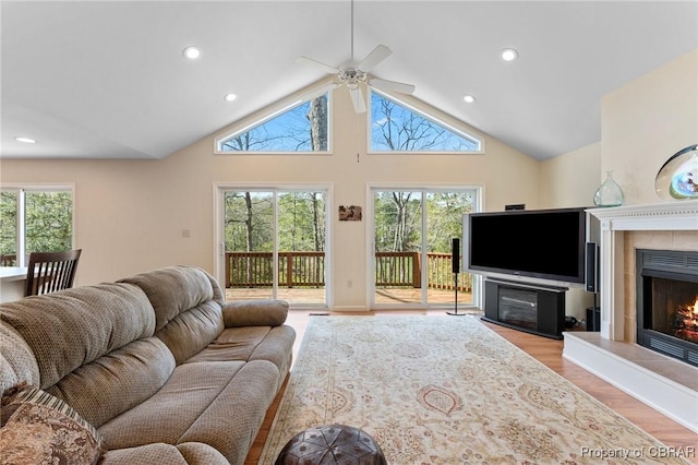 637 Mallard Bay Dr, Heathsville, VA 22473 - living room featuring plenty of natural light, a lit fireplace, a ceiling fan, and lofted ceiling