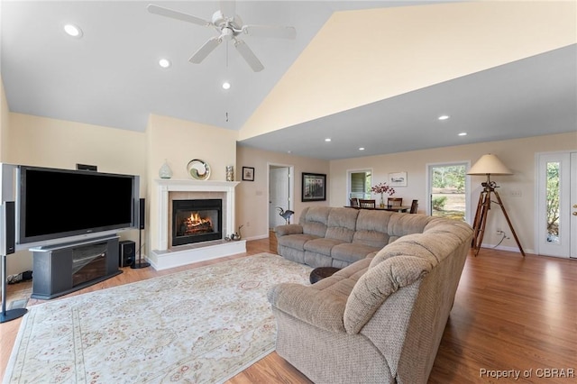 637 Mallard Bay Dr, Heathsville, VA 22473 - living room with baseboards, ceiling fan, wood finished floors, high vaulted ceiling, and a glass covered fireplace