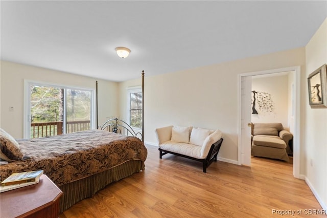 637 Mallard Bay Dr, Heathsville, VA 22473 - bedroom with light wood-style flooring, access to exterior, and baseboards