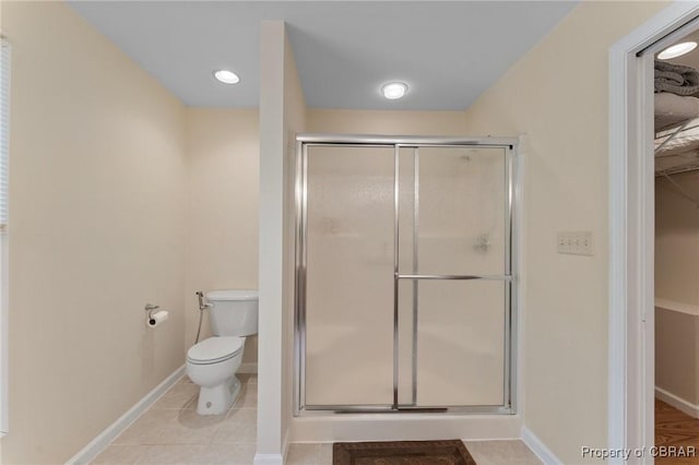 637 Mallard Bay Dr, Heathsville, VA 22473 - full bath featuring baseboards, toilet, a walk in closet, tile patterned flooring, and a stall shower