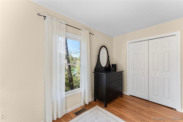 637 Mallard Bay Dr, Heathsville, VA 22473 - bedroom featuring visible vents, baseboards, light wood finished floors, and a closet