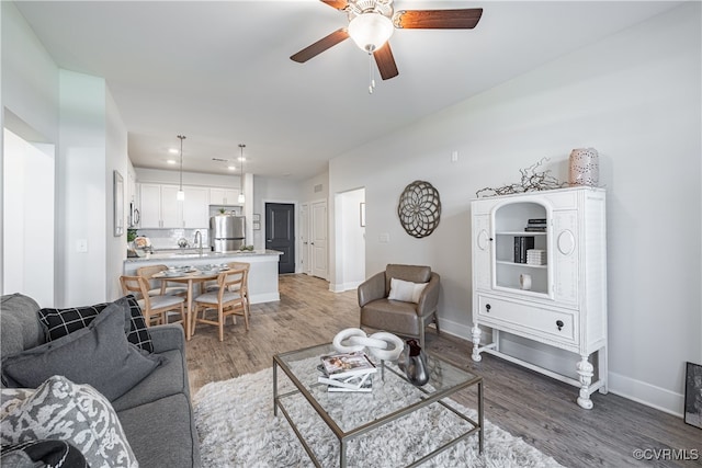 10526 Stony Bluff Dr Unit 308, Ashland, VA 23005 - living room with ceiling fan, baseboards, and wood finished floors