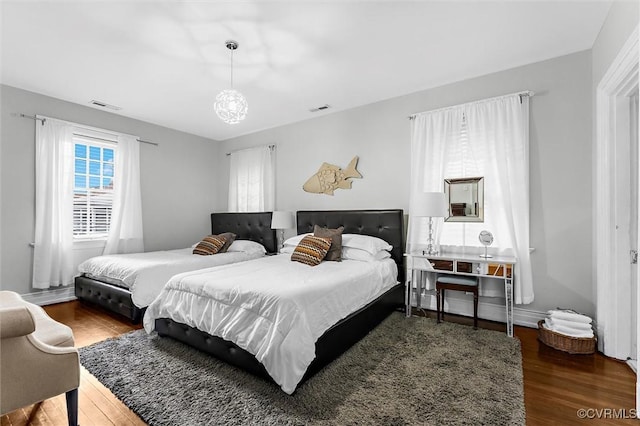 bedroom featuring wood finished floors