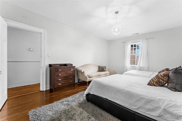 bedroom featuring wood finished floors