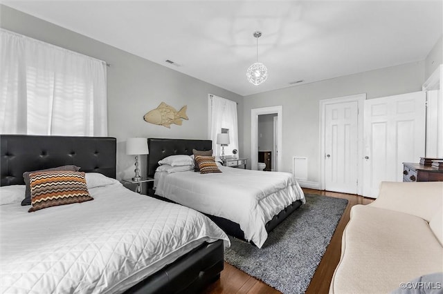 bedroom featuring wood finished floors