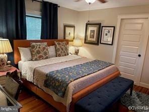 bedroom featuring ceiling fan and wood finished floors