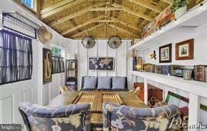 living area with vaulted ceiling