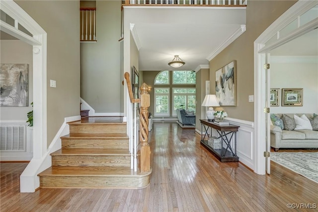 2600 Mulberry Row Rd, Midlothian, VA 23113 - staircase featuring hardwood / wood-style floors, crown molding, and a wainscoted wall
