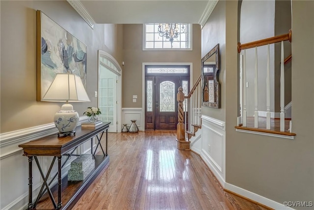 2600 Mulberry Row Rd, Midlothian, VA 23113 - foyer entrance with stairway, hardwood / wood-style floors, a chandelier, wainscoting, and ornamental molding