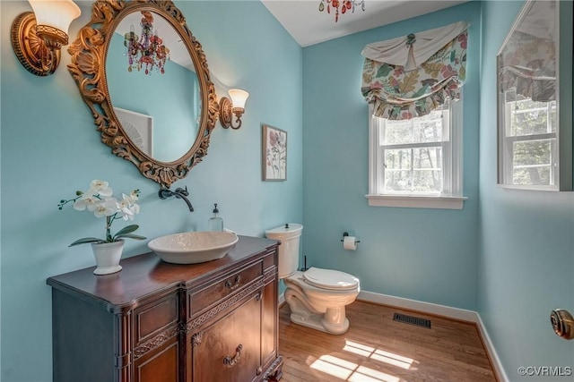 2600 Mulberry Row Rd, Midlothian, VA 23113 - half bathroom with wood finished floors, baseboards, vanity, and toilet