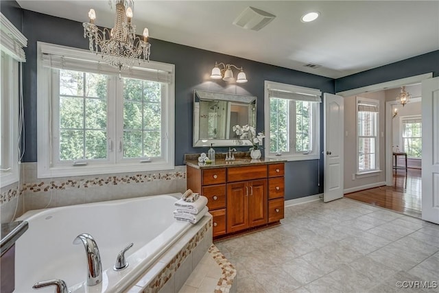 2600 Mulberry Row Rd, Midlothian, VA 23113 - bathroom with a chandelier, healthy amount of natural light, a bath, and recessed lighting