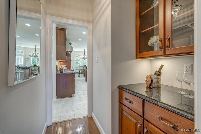 2600 Mulberry Row Rd, Midlothian, VA 23113 - bar featuring a chandelier, baseboards, wood finished floors, recessed lighting, and dishwasher