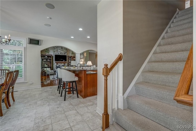 2600 Mulberry Row Rd, Midlothian, VA 23113 - stairway with arched walkways, baseboards, a chandelier, and recessed lighting