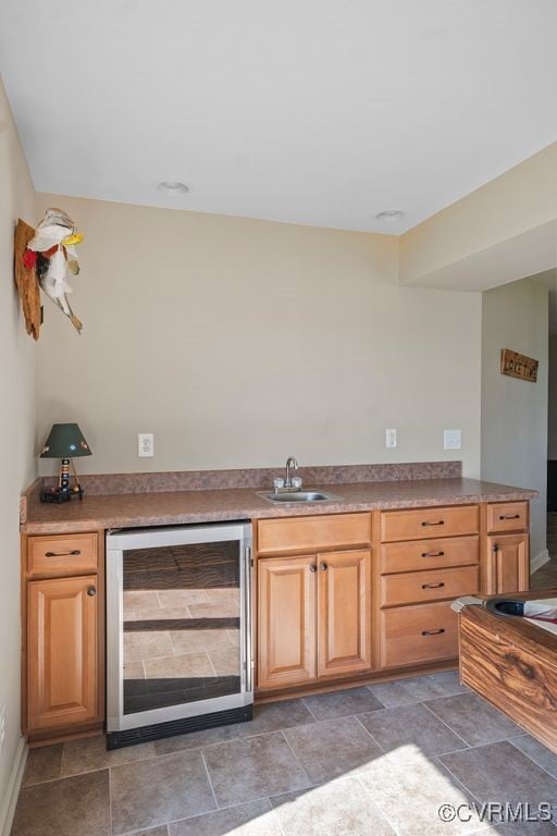 bar featuring indoor wet bar, a sink, and wine cooler