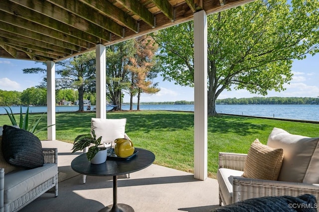 view of patio with a water view