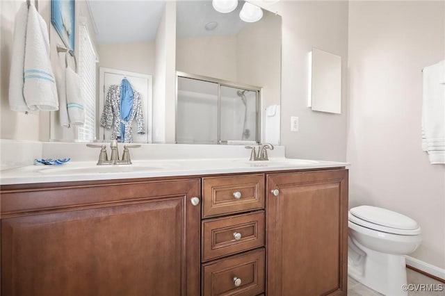 17318 Library Blvd, Ruther Glen, VA 22546 - bathroom featuring a sink, toilet, double vanity, and a shower with shower door