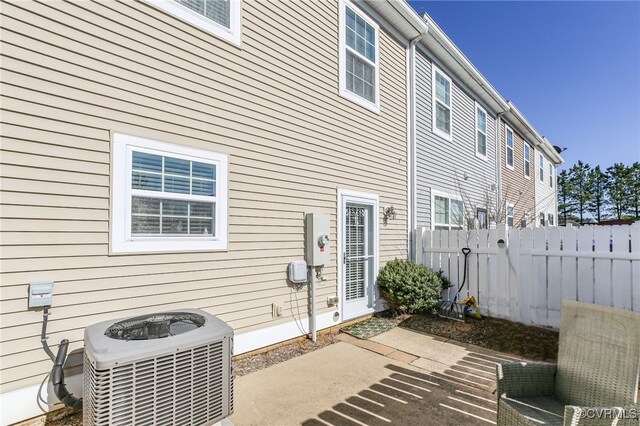17318 Library Blvd, Ruther Glen, VA 22546 - rear view of house with a patio area, central AC unit, and fence