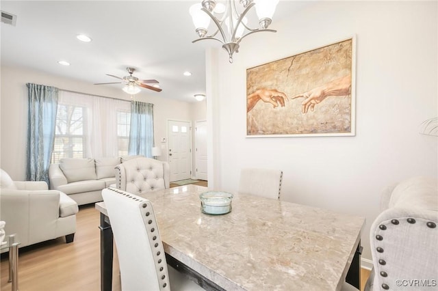 17318 Library Blvd, Ruther Glen, VA 22546 - dining area featuring recessed lighting, visible vents, light wood-type flooring, and ceiling fan with notable chandelier