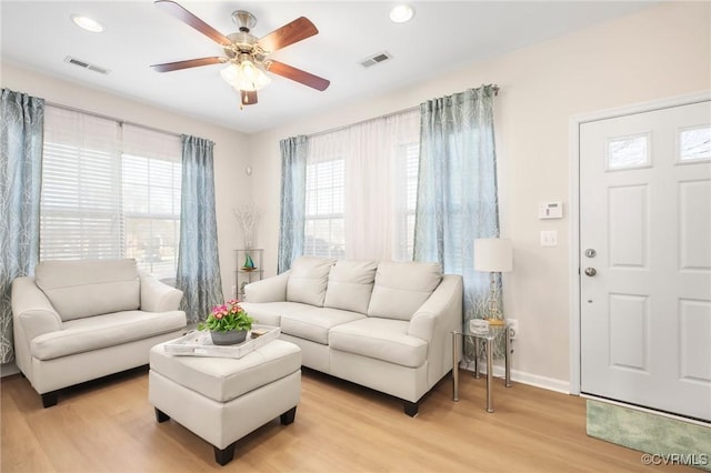 17318 Library Blvd, Ruther Glen, VA 22546 - living area featuring light wood-style floors, baseboards, a ceiling fan, and visible vents
