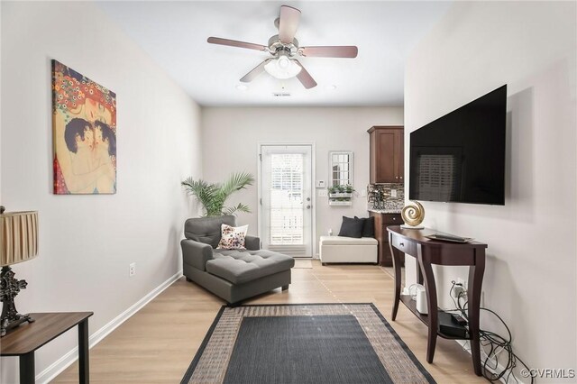 17318 Library Blvd, Ruther Glen, VA 22546 - living area with light wood-style floors, ceiling fan, baseboards, and visible vents
