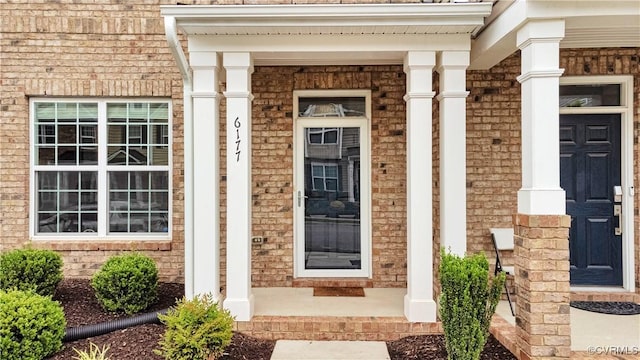 6177 Bowline Ln, Richmond, VA 23234 - property entrance featuring a porch and brick siding
