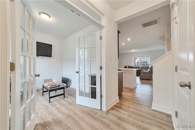 6177 Bowline Ln, Richmond, VA 23234 - hallway with french doors and light wood-style floors
