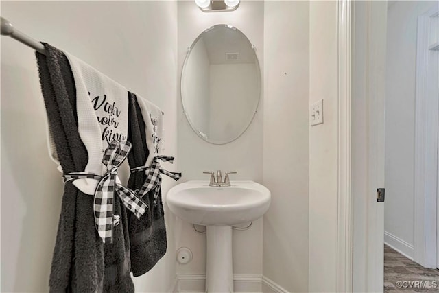 6177 Bowline Ln, Richmond, VA 23234 - bathroom with a sink and wood finished floors