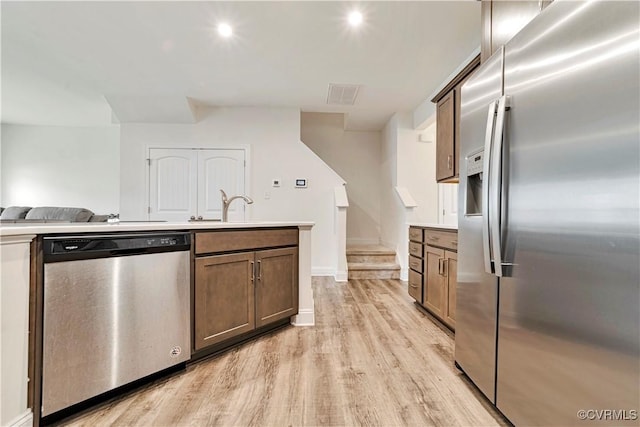 6177 Bowline Ln, Richmond, VA 23234 - kitchen featuring stainless steel appliances, light wood finished floors, light countertops, and recessed lighting