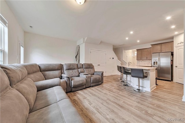 6177 Bowline Ln, Richmond, VA 23234 - living room featuring light wood-style flooring and recessed lighting