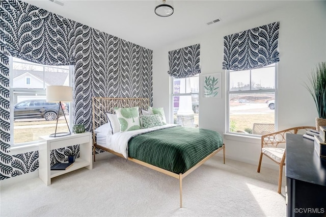 bedroom with carpet flooring and visible vents