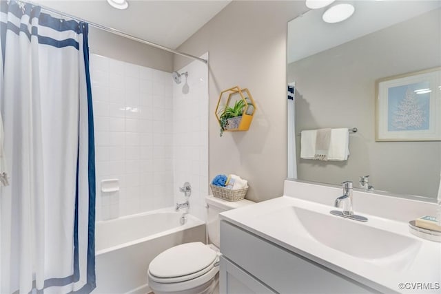 bathroom featuring vanity, shower / bathtub combination with curtain, and toilet