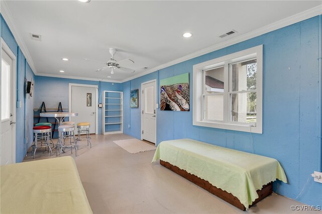 bedroom with recessed lighting, finished concrete floors, visible vents, and ornamental molding