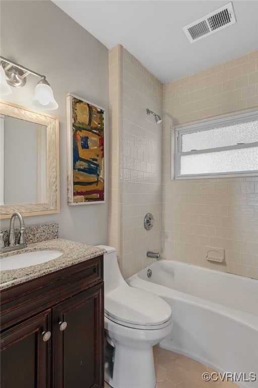full bathroom with vanity, toilet, tile patterned flooring, visible vents, and bathing tub / shower combination