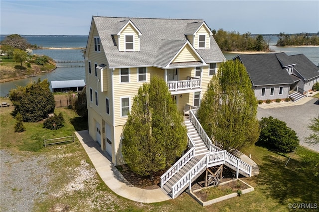 birds eye view of property featuring a water view