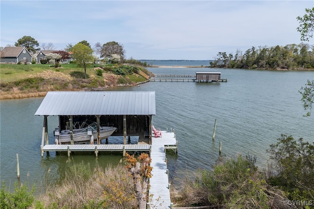 view of dock featuring boat lift and a water view