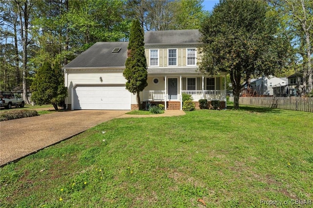 colonial house with driveway, covered porch, fence, a front yard, and a garage