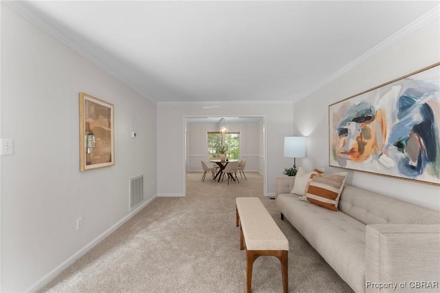 living room with light carpet, visible vents, baseboards, and ornamental molding