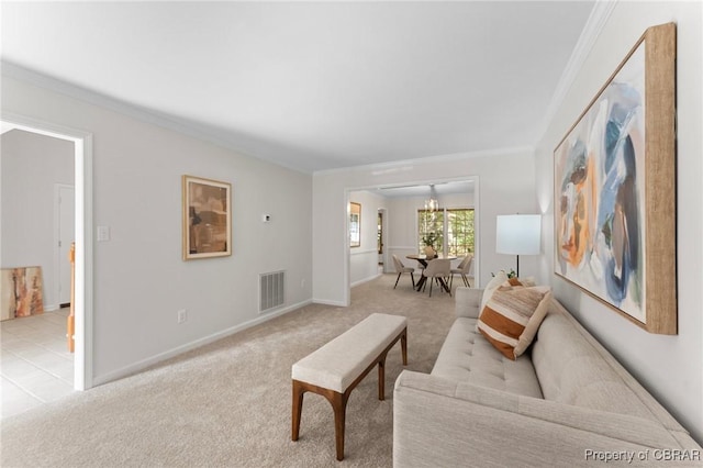 living area featuring a notable chandelier, baseboards, light carpet, crown molding, and visible vents