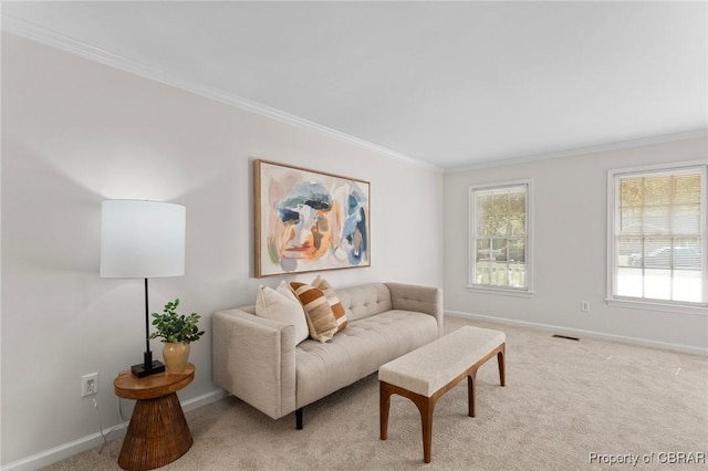 living room with light carpet, visible vents, baseboards, and ornamental molding