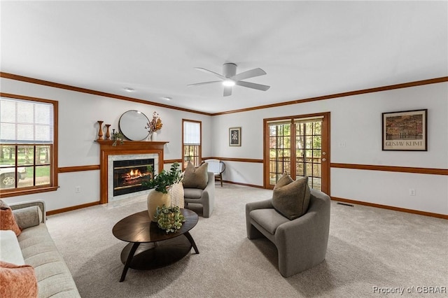 living room with carpet floors, a tile fireplace, and baseboards