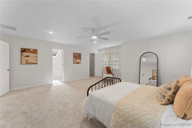 bedroom featuring ensuite bathroom, baseboards, visible vents, recessed lighting, and light colored carpet
