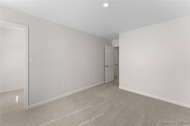unfurnished room featuring recessed lighting, baseboards, and carpet floors